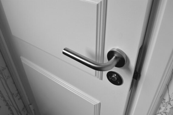 semi open white wooden door